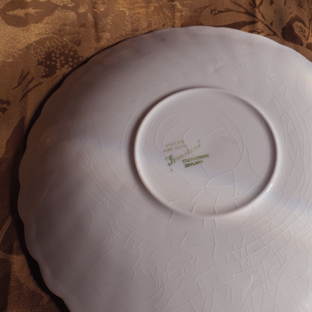 Bougie grande tasse dorée parfum agrumes gingembre, dans une tasse de collection